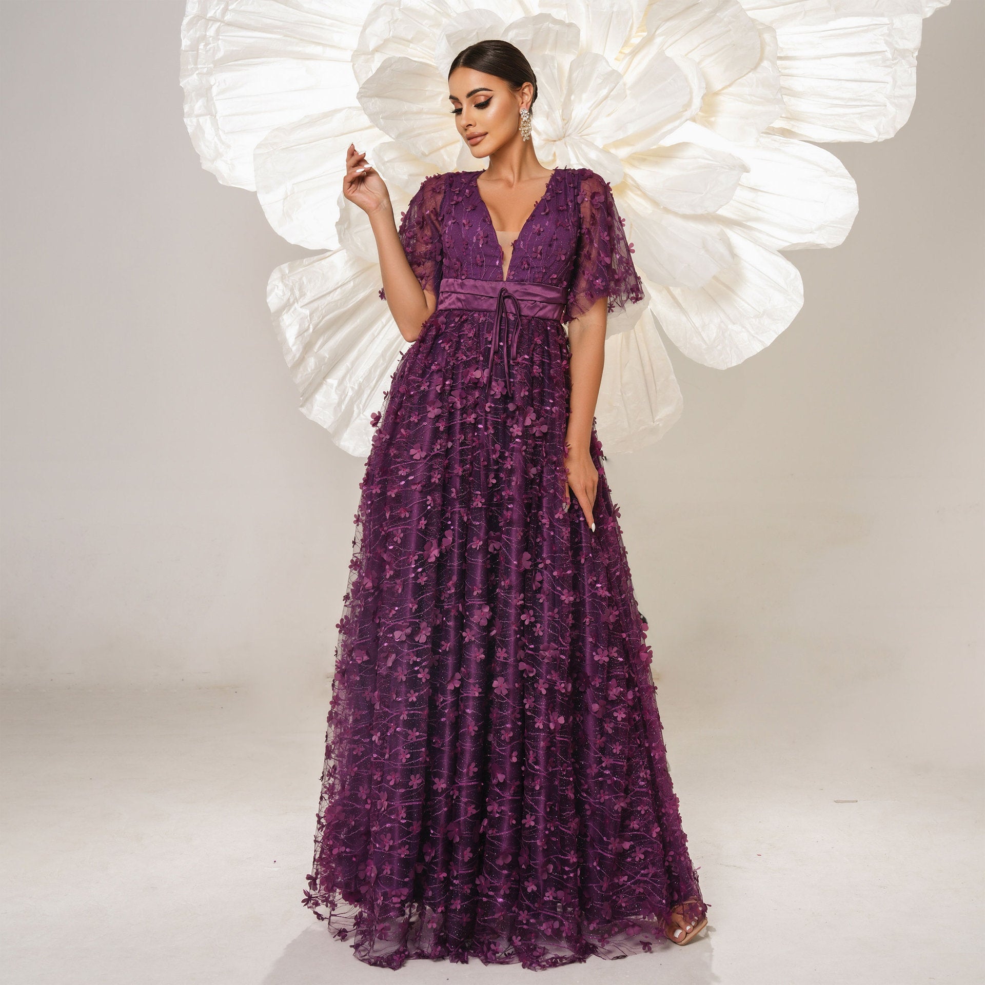 Elegant purple floral-embellished gown from Langry fashion collection for bridesmaid or evening wear