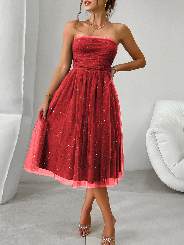 Strapless red tulle cocktail dress with sparkly details, perfect for elegant fashion occasions