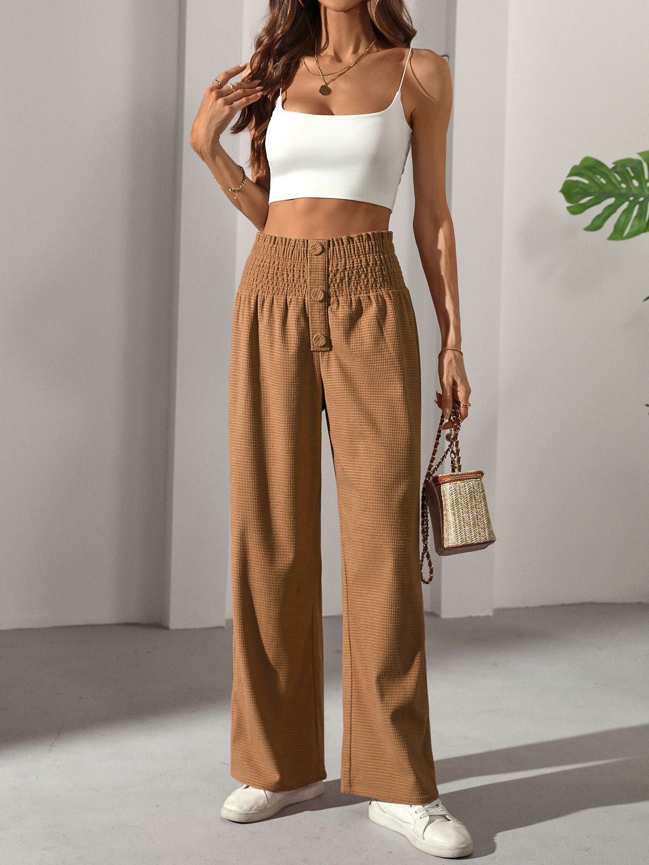 Casual Elegant French trousers featuring smocked waist and wide-leg design in light brown