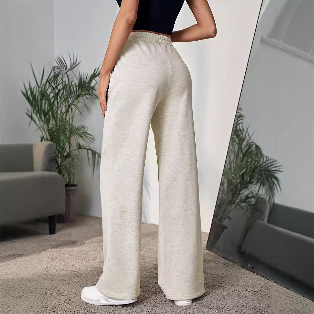 Wide leg cream sweatpants with elastic waistband, perfect for modern langry fashion