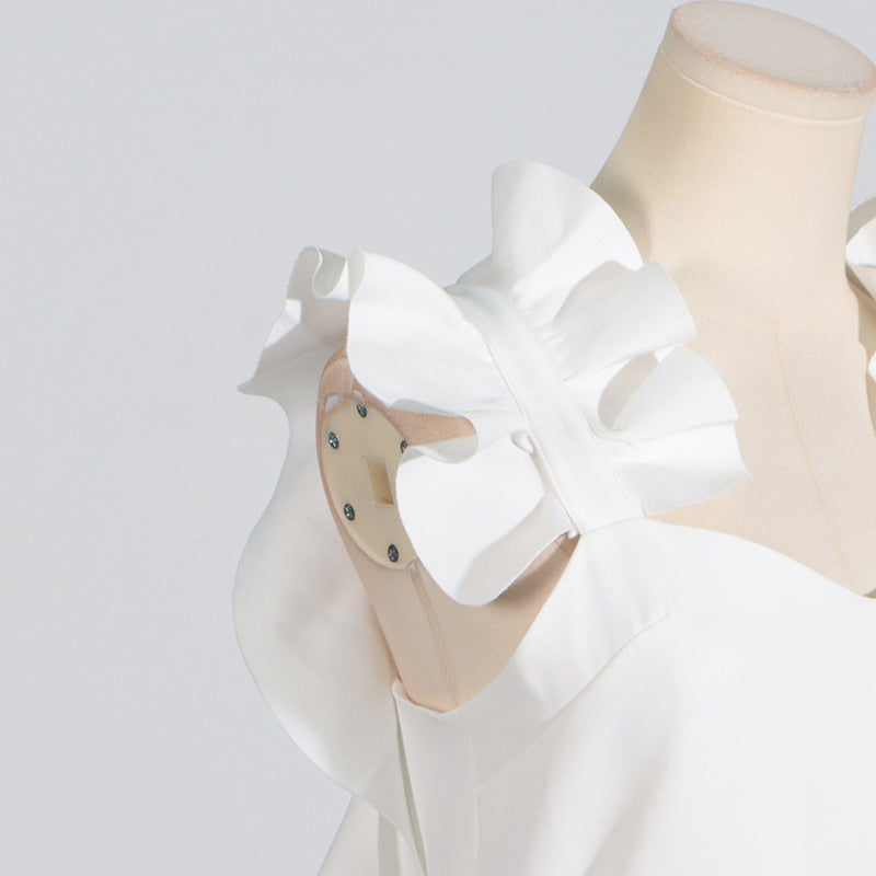 White ruffled dress on mannequin, showcasing Langry fashion and ملابس for summer style