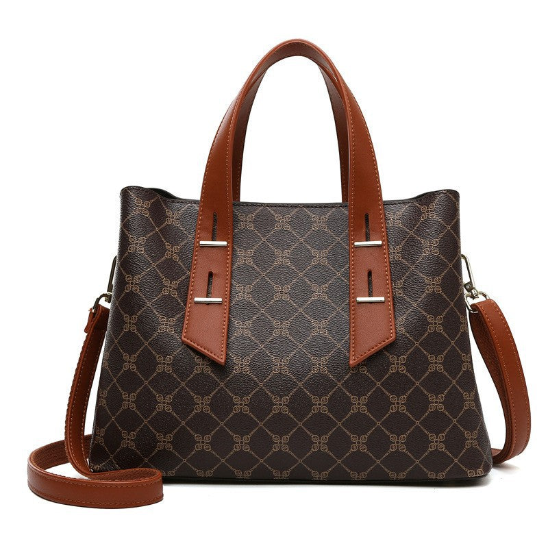 High-grade soft leather handbag in brown tan pattern with accents
