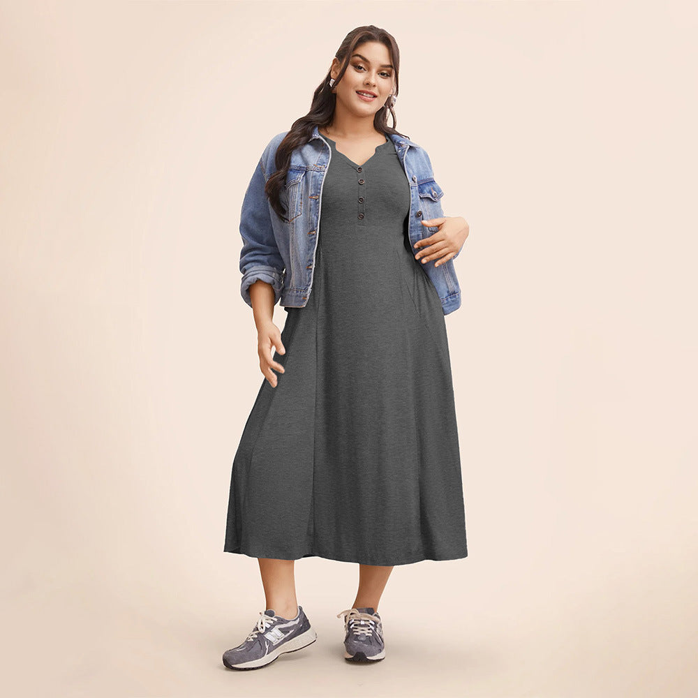 Woman in winter loose langry fashion midi dress with denim jacket and athletic shoes