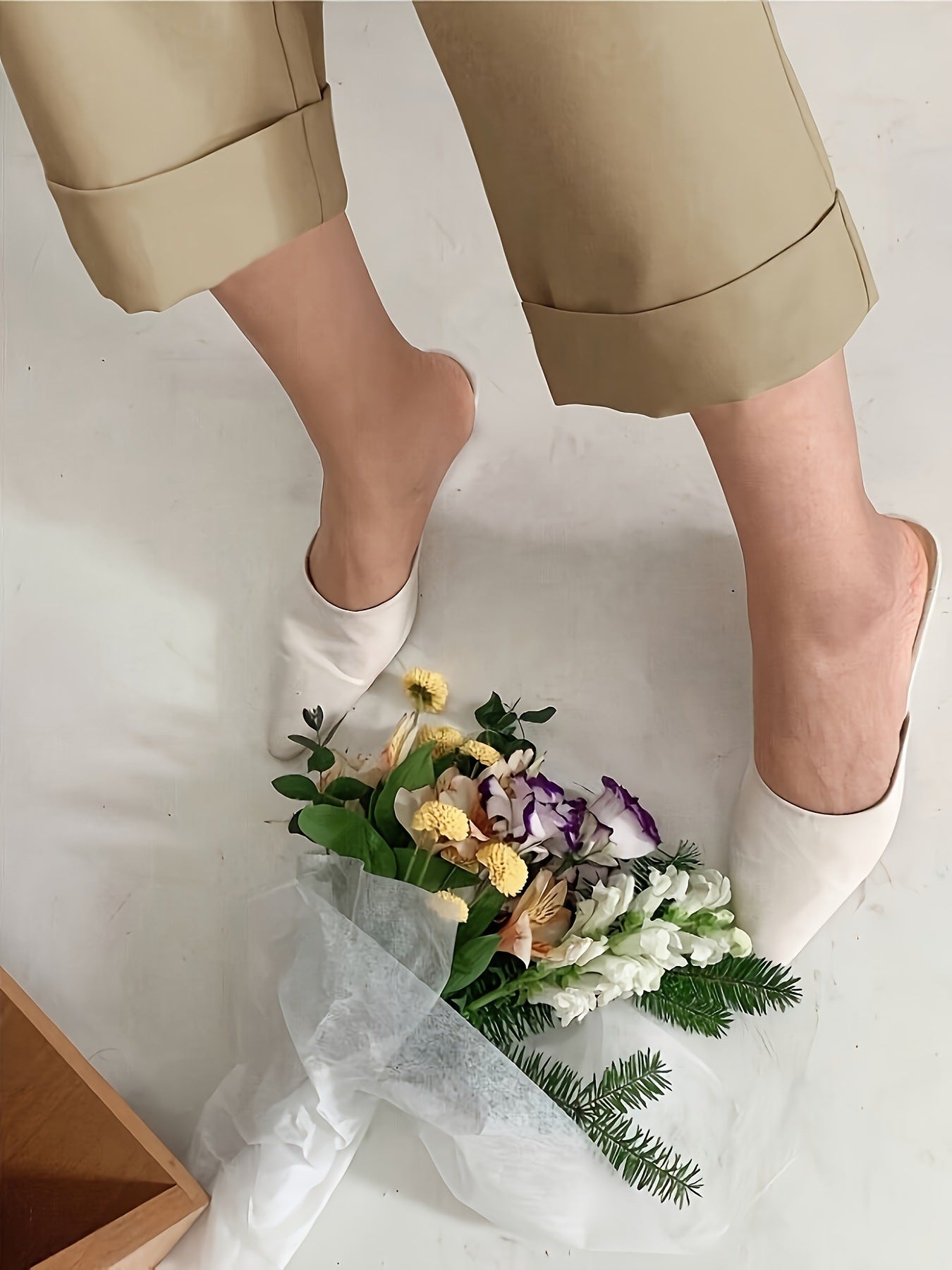White slippers on a floral bouquet beside Office Drooping Slimming Wide Leg Pant
