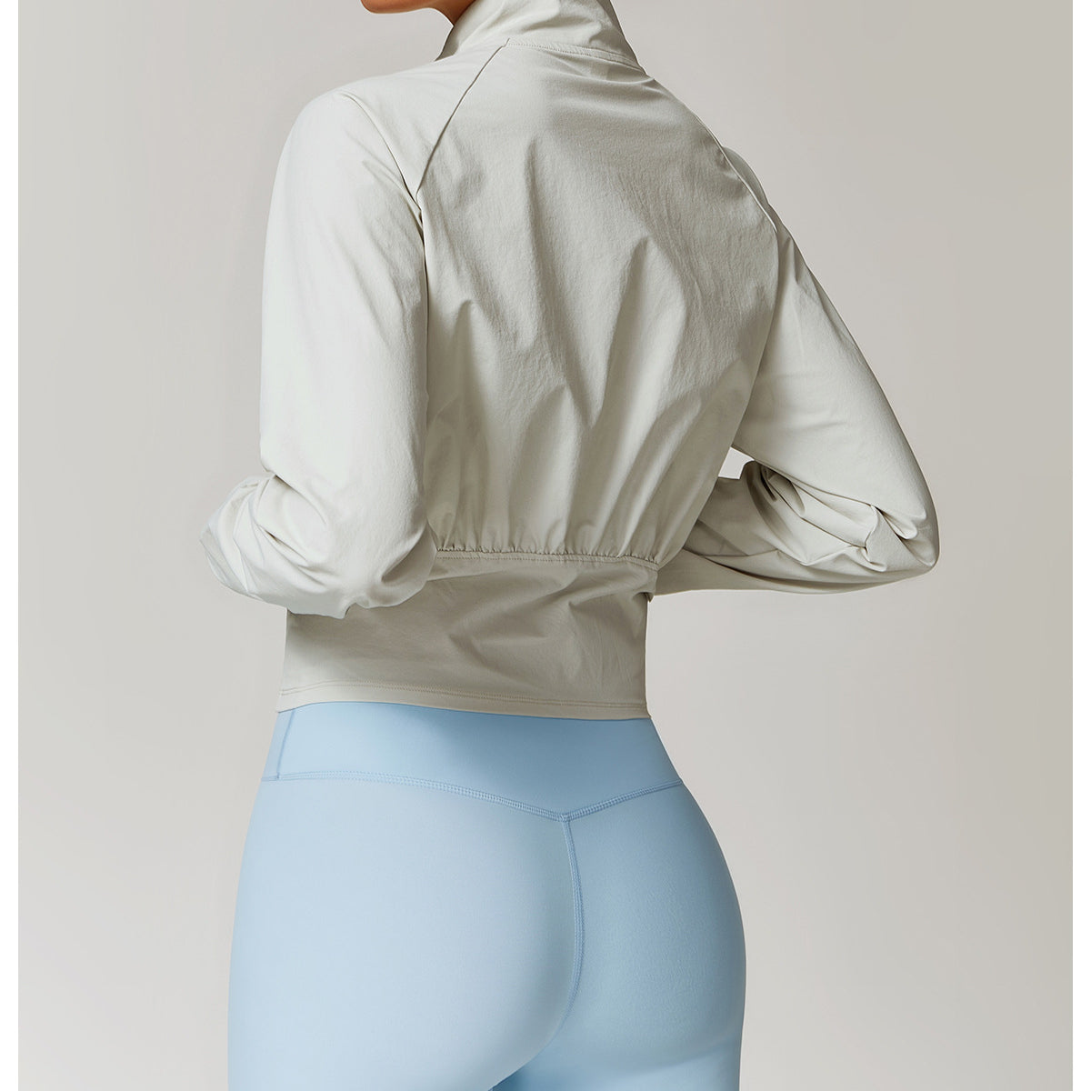 Light blue high-waisted leggings and beige cropped jacket for fashionable langry ملابس
