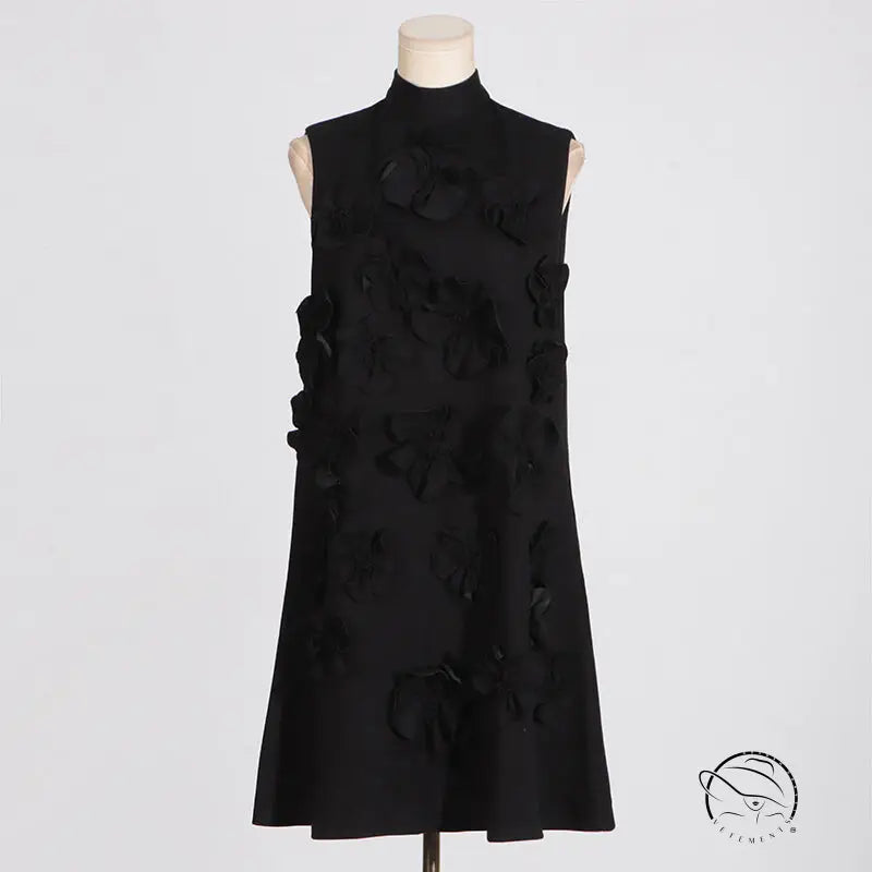 Retro socialite sleeveless black dress with tie bow and floral embellishments