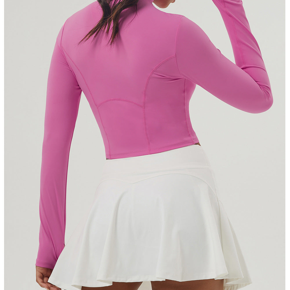 Long sleeve pink athletic top and white tennis skirt for women’s outdoor sports fashion