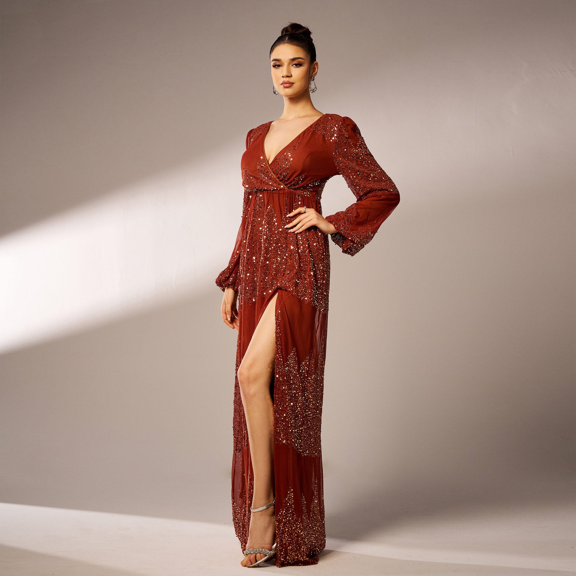 Elegant maroon gown with a thigh-high slit, perfect for high-end fashion events