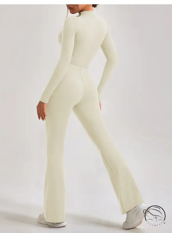 Cream-colored long-sleeve one piece sportswear jumpsuit with flared legs