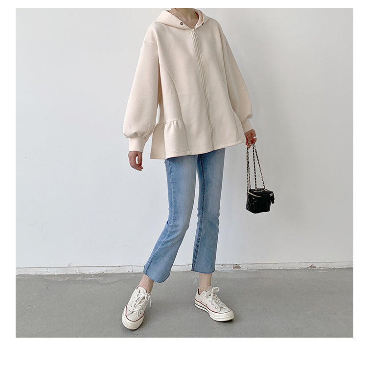 Cream-colored Letian Ruffled Hooded Jacket paired with jeans and sneakers from Vetements winter collection