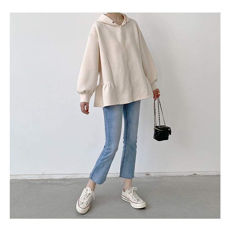 Cream-colored Letian Ruffled Hooded Jacket paired with jeans and sneakers from Vetements winter collection