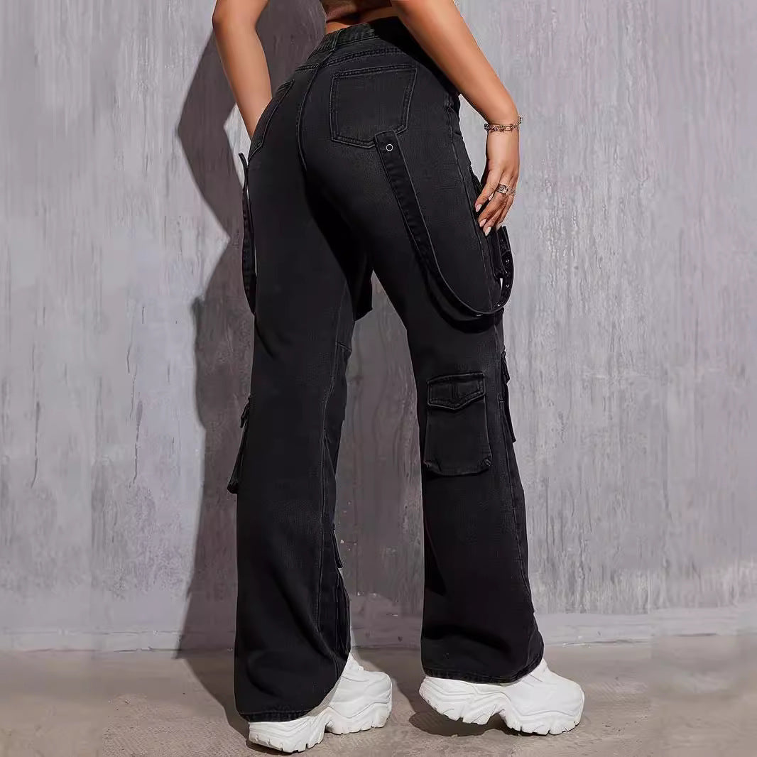 Black denim cargo pants with straps and pockets paired with white platform sneakers for hip hop fashion