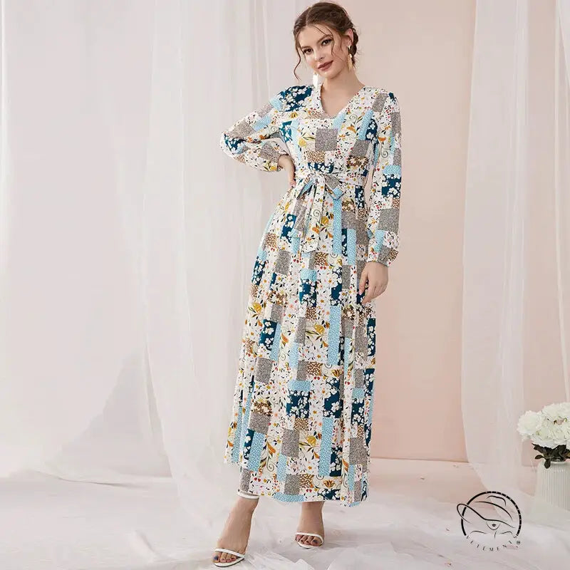 Woman in floral print slim fit maxi dress with blue beige gray patchwork