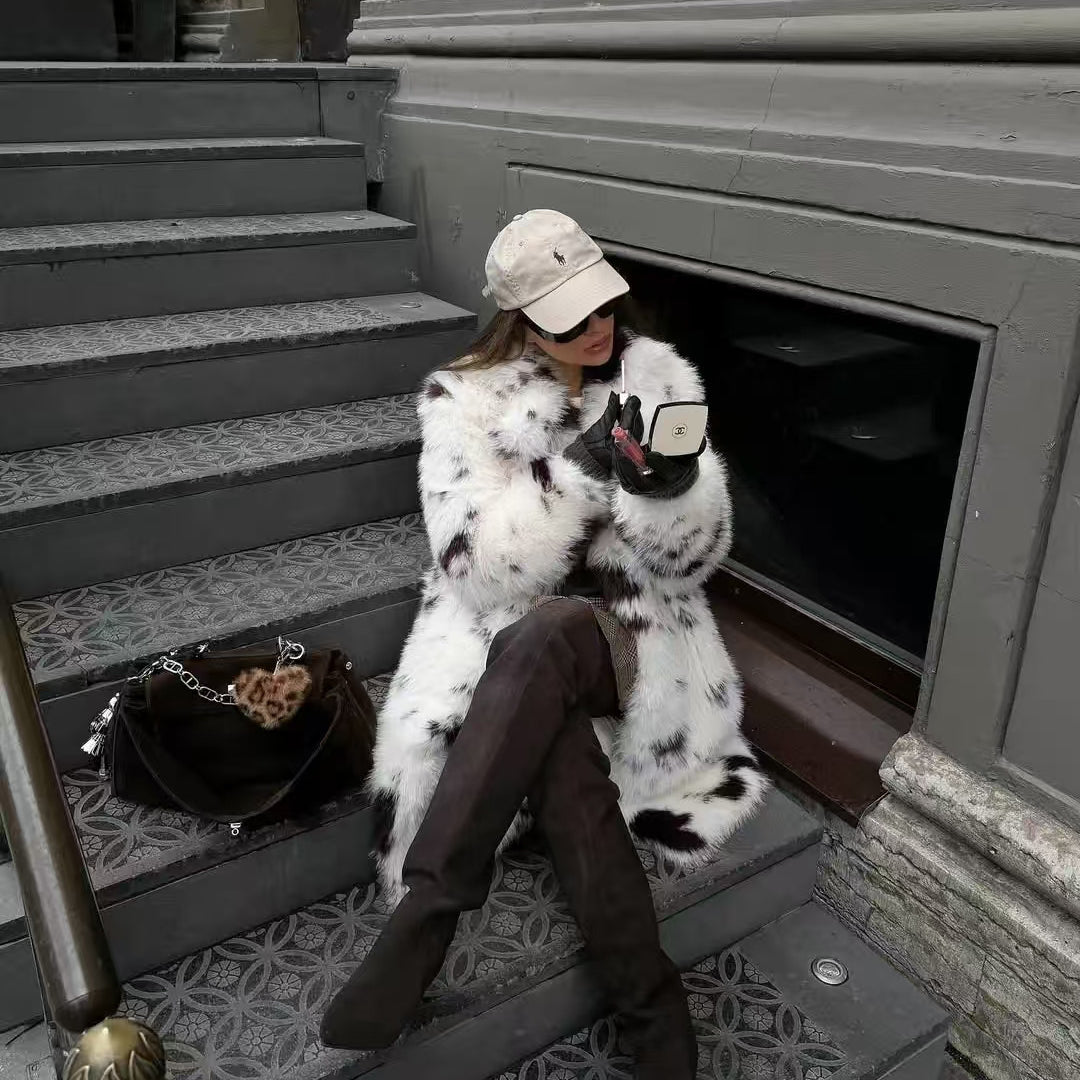 Cozy faux fur long coat with white black speckled hood by Mackage fashion