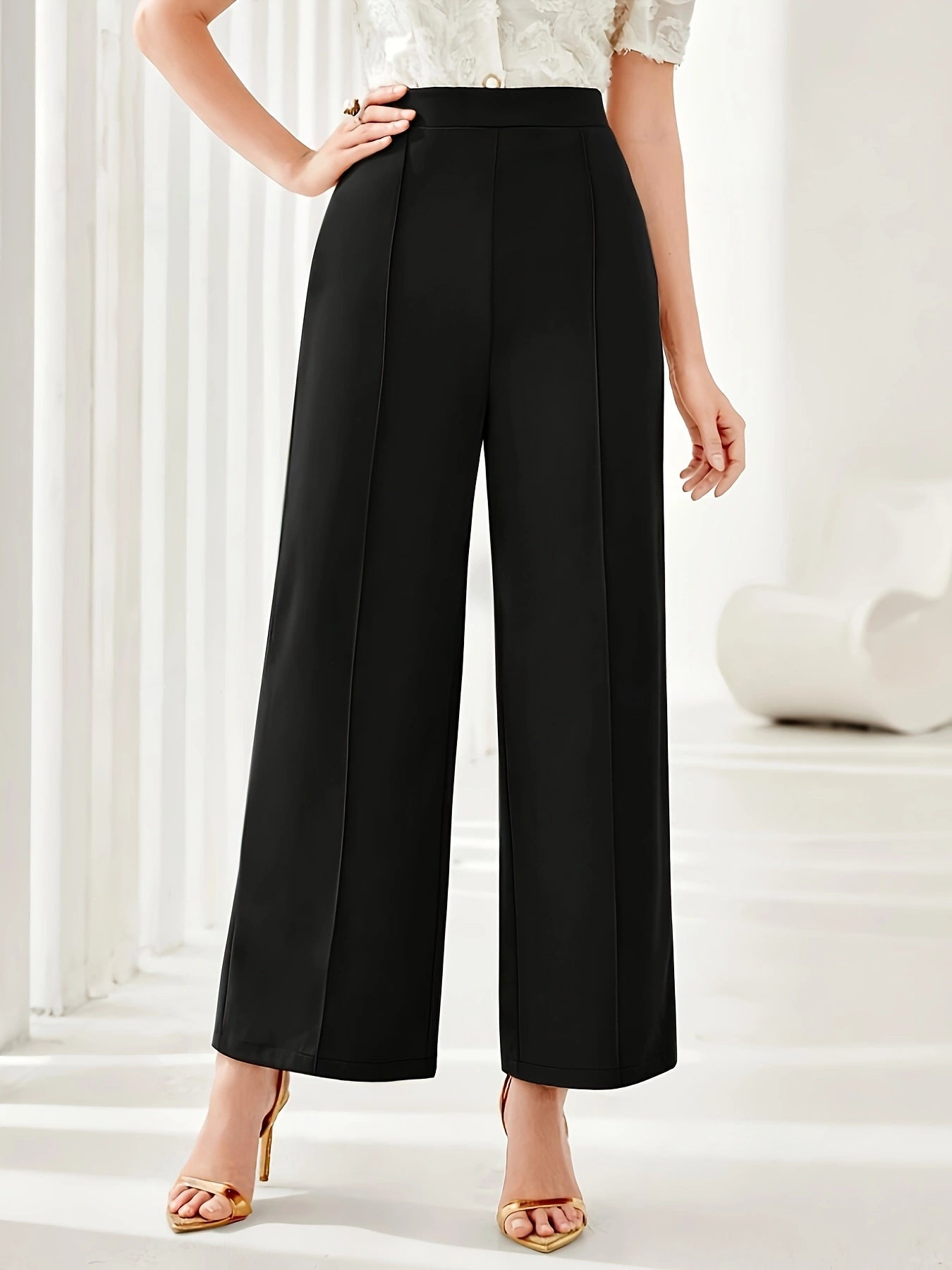 Black high-waisted wide leg dress pants with pressed creases for elegant fashion