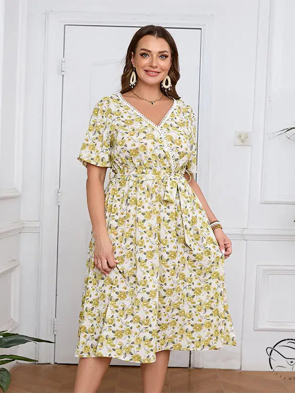 Boho lace floral dress with white V-neck, tie waist, and short sleeves