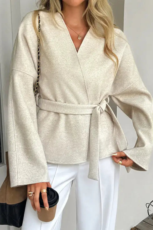 Beige kimono-style langry fashion blouse with bell sleeves and self-tie waistband