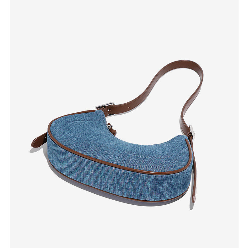 Elegant denim crescent shoulder bag showcasing stylish fashion and versatile ملابس options