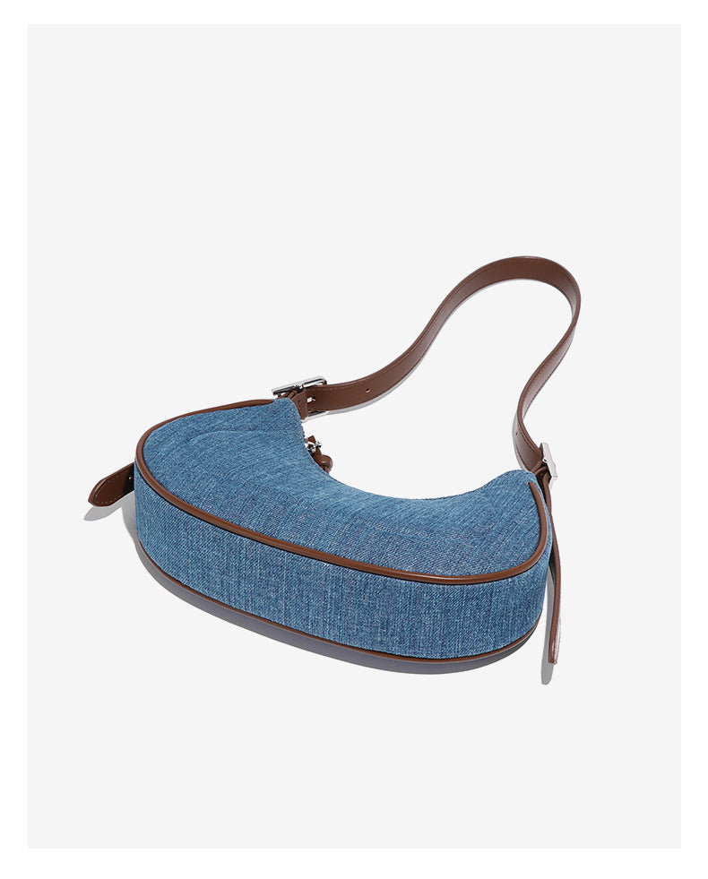 Elegant denim crescent shoulder bag showcasing stylish fashion and versatile ملابس options