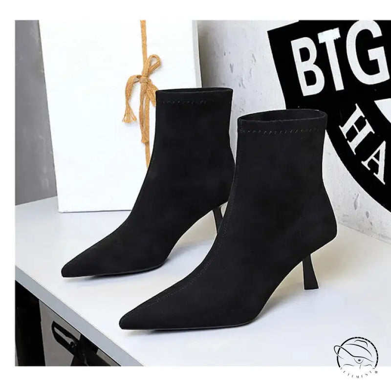 Black suede ankle fashion boots with pointed toes and low heels