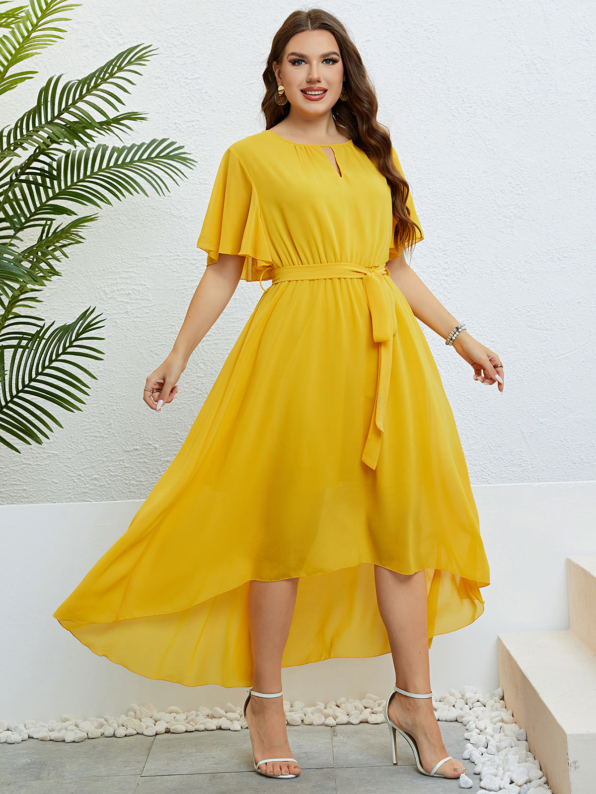 Woman in yellow high-low dress showcasing elegant lace, available with free shipping from Langry