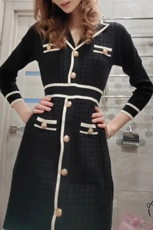 Knitted classic dress in black and white trim with gold buttons