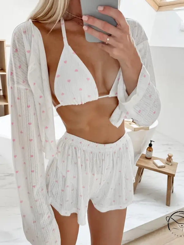 White knitted pajamas three piece set with heart-patterned bikini top, shorts, and cover-up