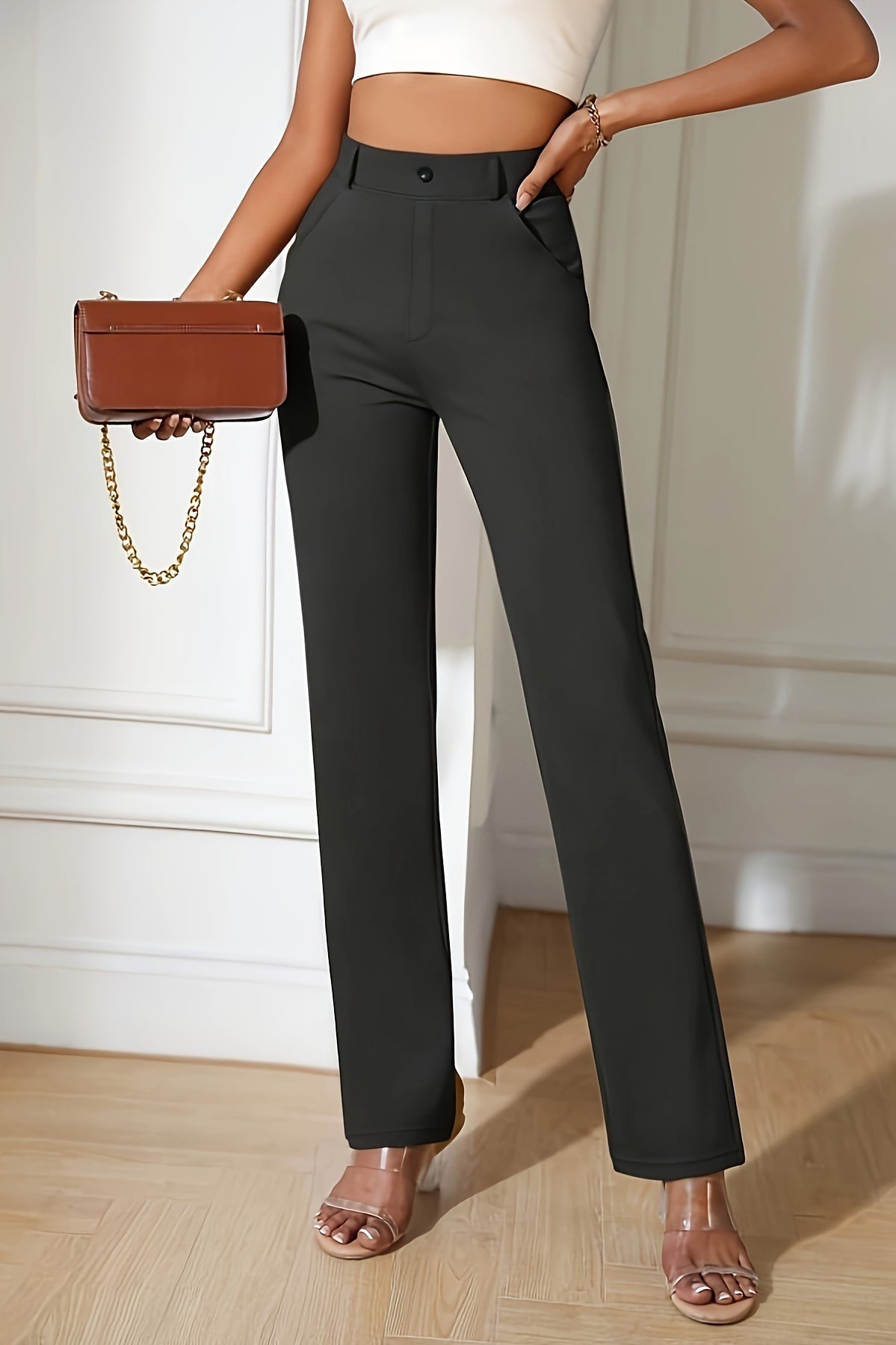 High-waisted black dress pants for casual office fashion with a straight-leg silhouette