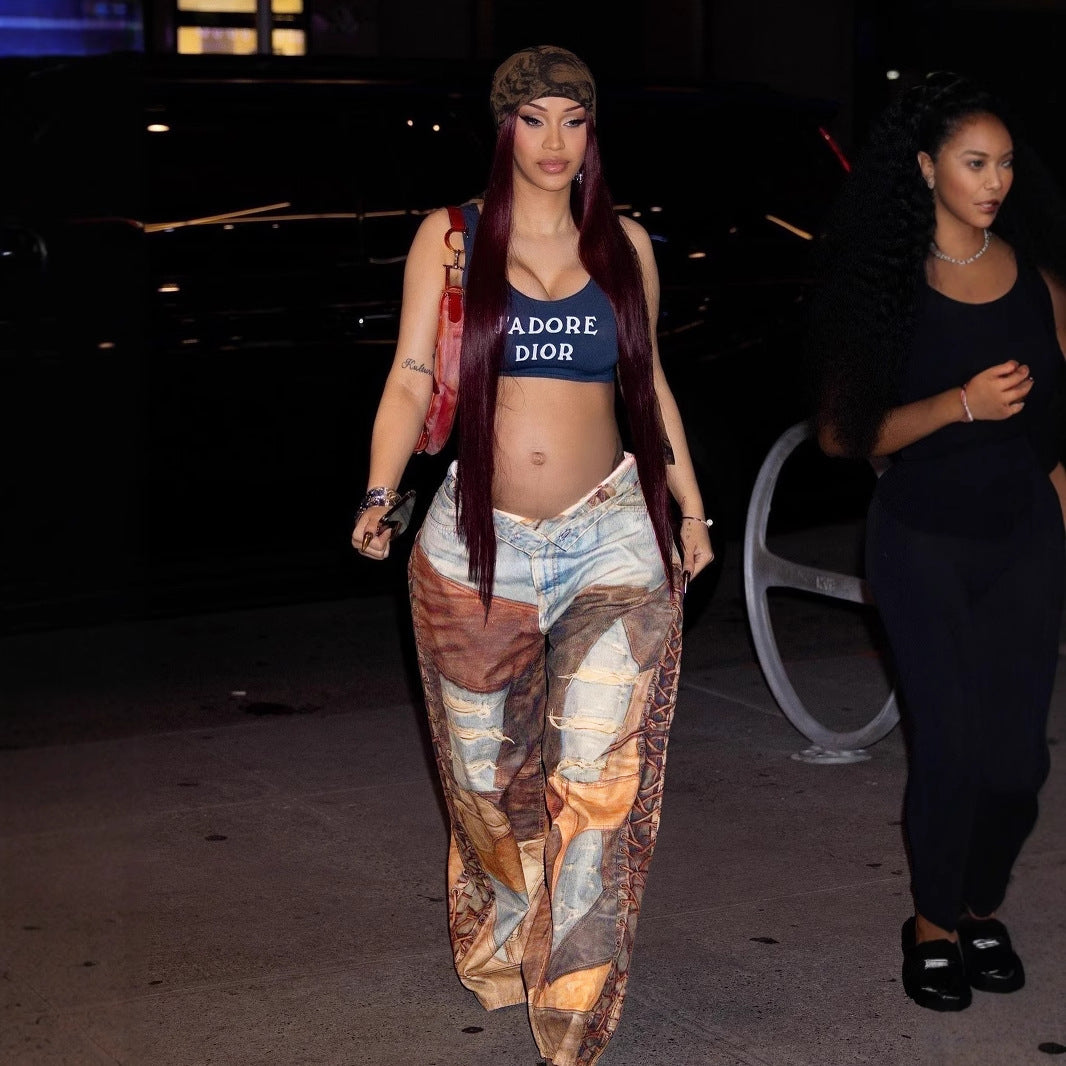 Woman in JADORE DIOR crop top and patterned wide-leg pants showcasing trendy ملابس