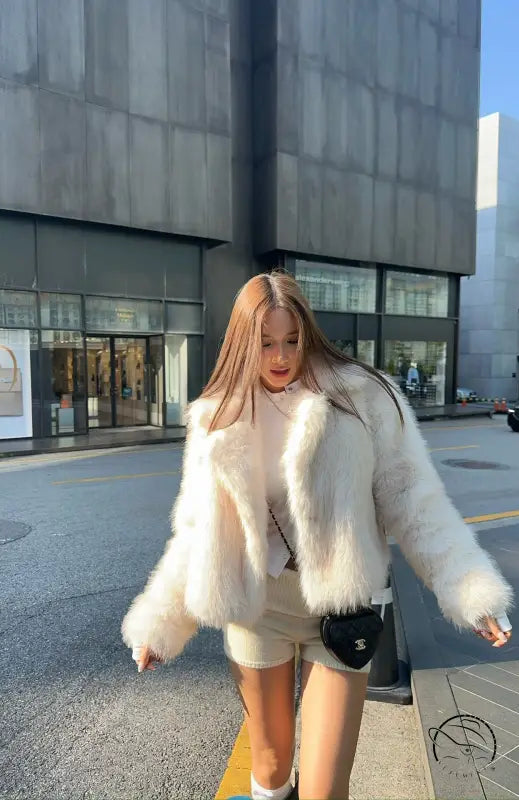 Langry short loose faux fur coat with cream jacket, black trim, white collar