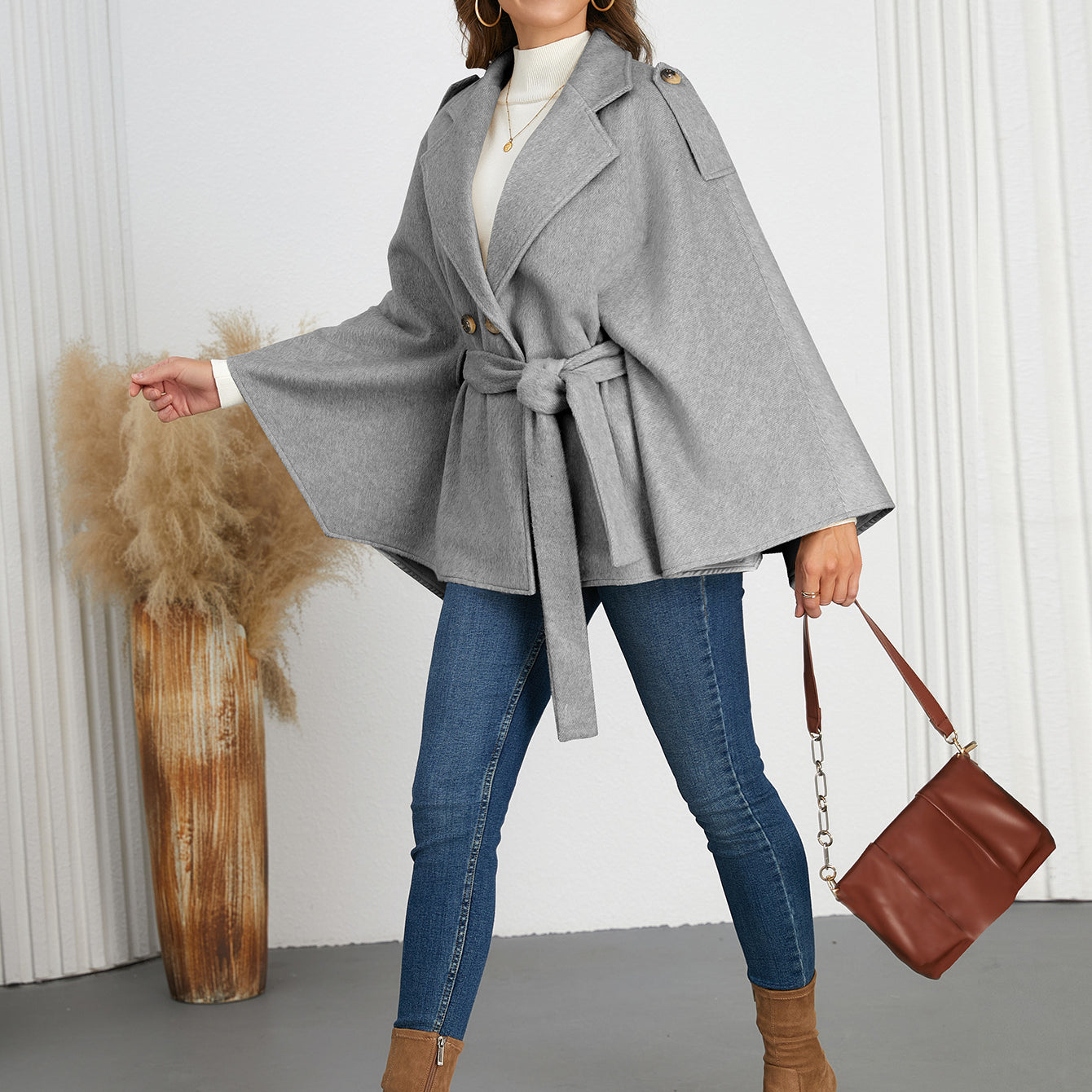 Woman in gray belted cape coat for stylish winter fashion by Langry ملابس