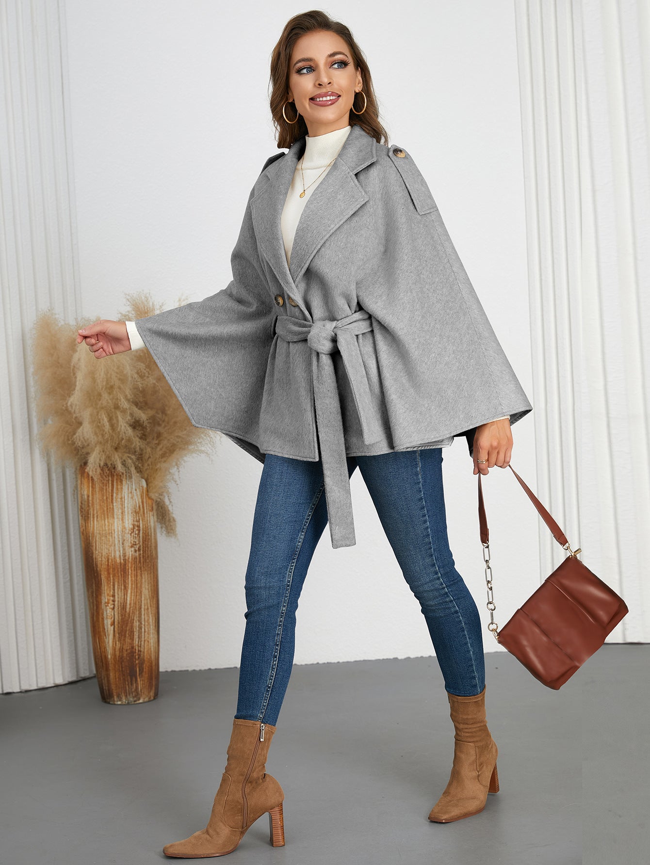 Woman in gray belted cape coat for stylish winter fashion by Langry ملابس