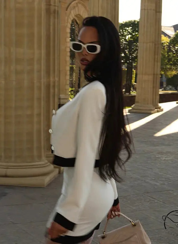 White and black striped long sleeve top with short skirt set