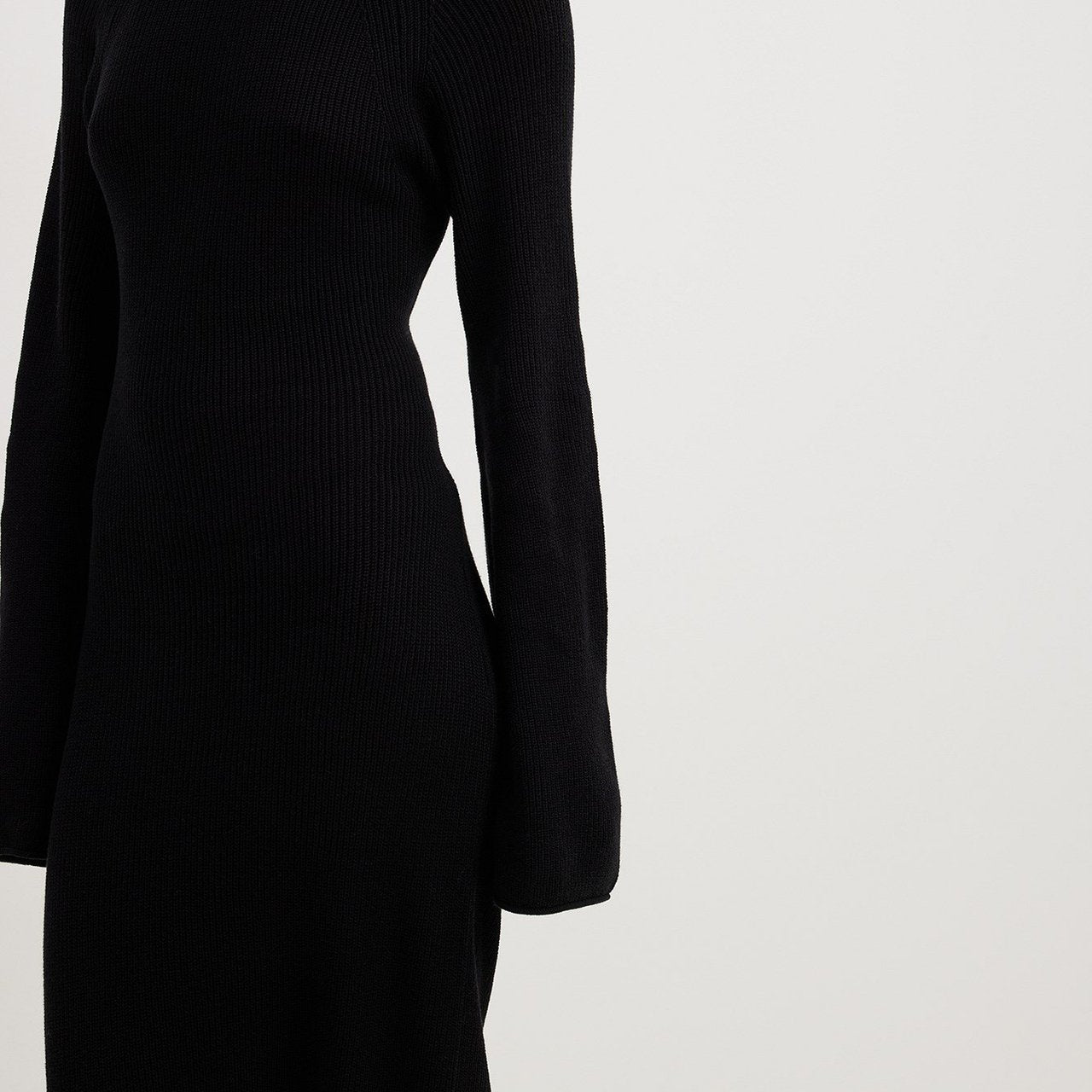 Black knit dress with long bell sleeves, ideal for fashionable langry ملابس outfits