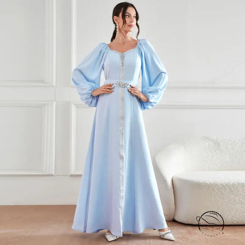 Elegant high waist langry fashion dress in light blue satin with puff sleeves and beaded waistband