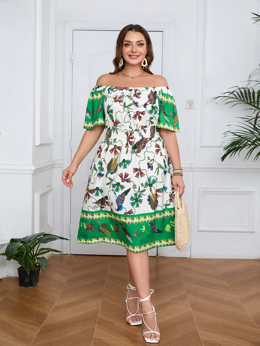 Elegant bohemian dress with vibrant bird and leaf pattern, straw tote, and white sandals