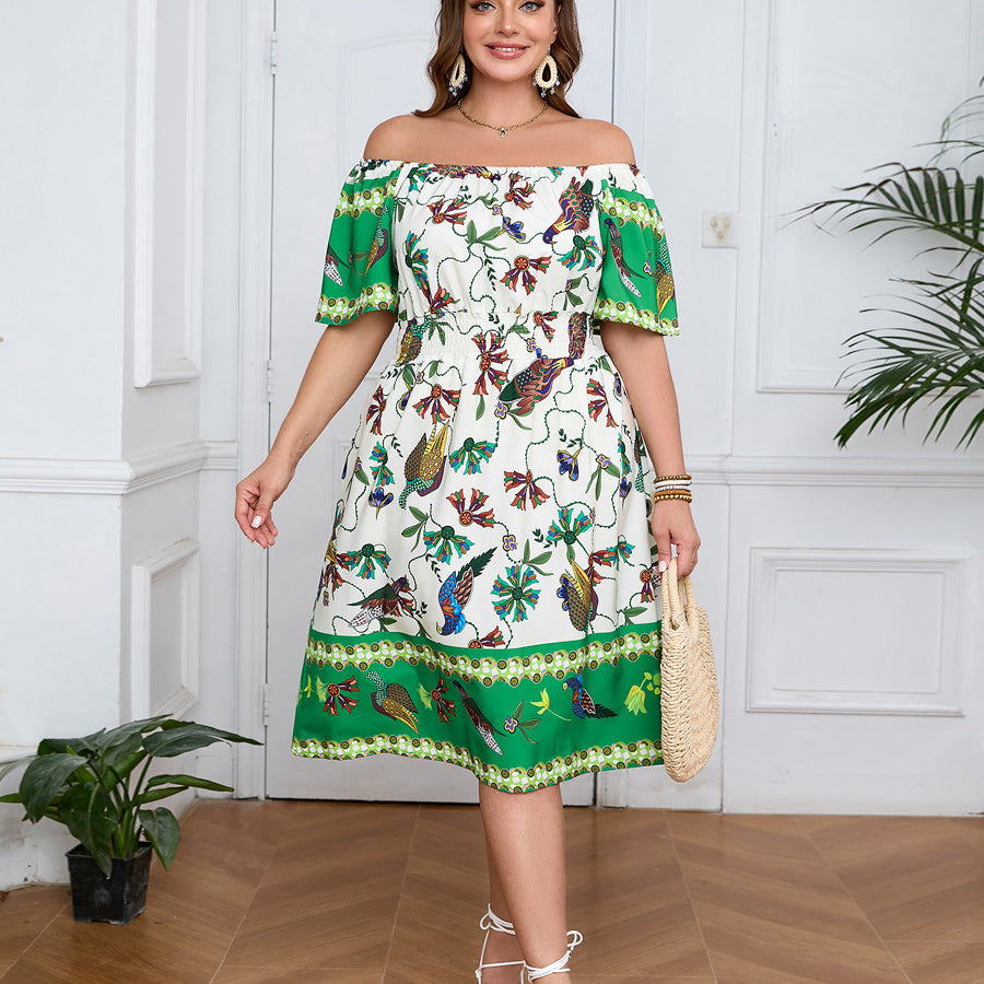 Elegant bohemian dress with vibrant bird and leaf pattern, straw tote, and white sandals