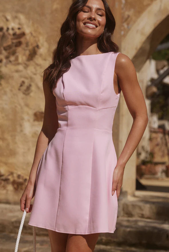 Sleeveless light pink fit-and-flare dress, ideal for elegant fashion occasions
