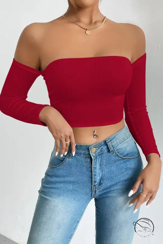 Red camisole waist trimming short sleeve crop top with light wash jeans