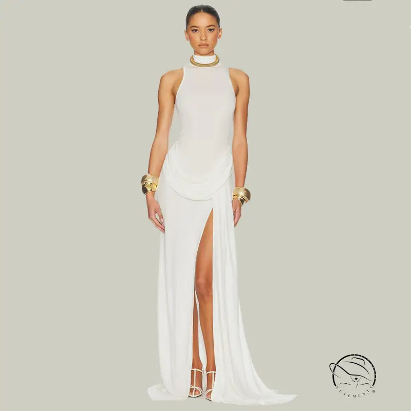 White high-split evening gown with tight waist, gold accents, and Langry jewelry