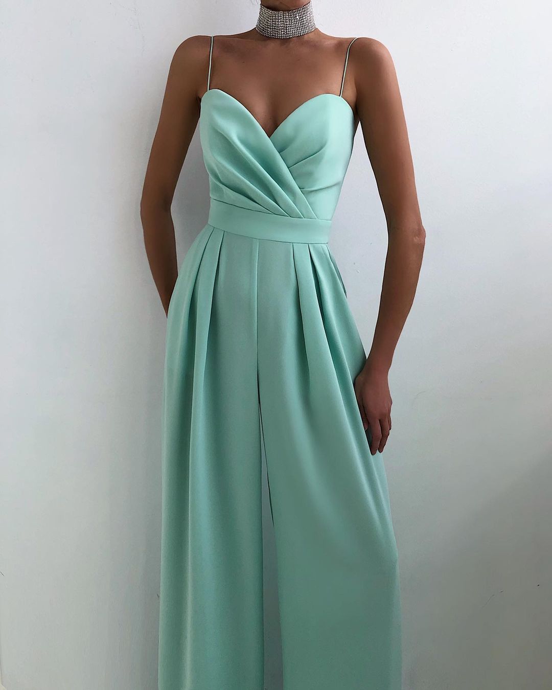 Mint green strapless formal gown with pleated details and sweetheart neckline for fashion