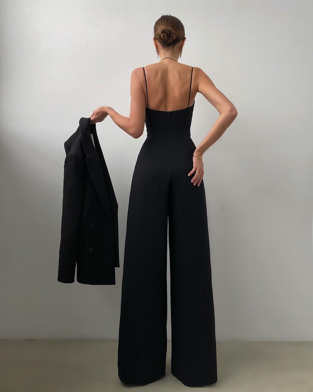 Elegant and Modern Jumpsuit in black with wide-leg design and spaghetti straps for fashion