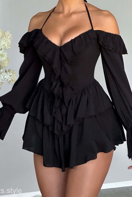 Black off-the-shoulder ruffled romper featured in HALTER LOW CUT RUFFLED DRESS for a sexy halter low look