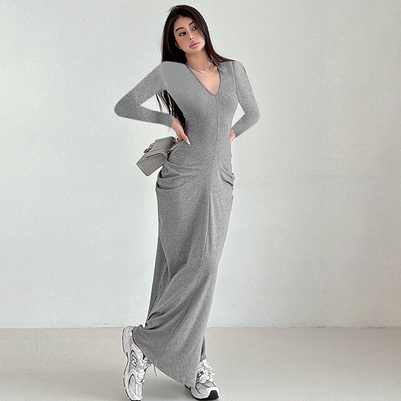 Long grey ribbed maxi dress with white sneakers, a stylish fashion choice in ملابس