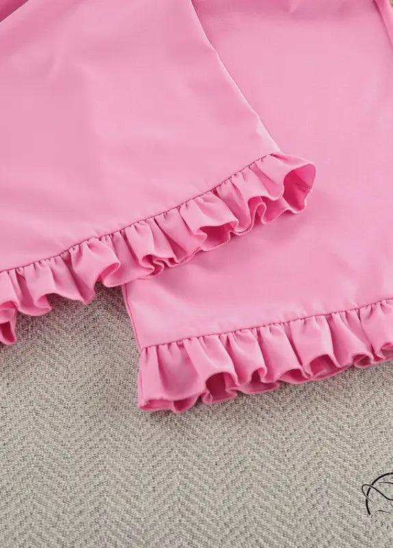 Pink ruffled langry swim trunks in smooth fabric for fashion ملابس