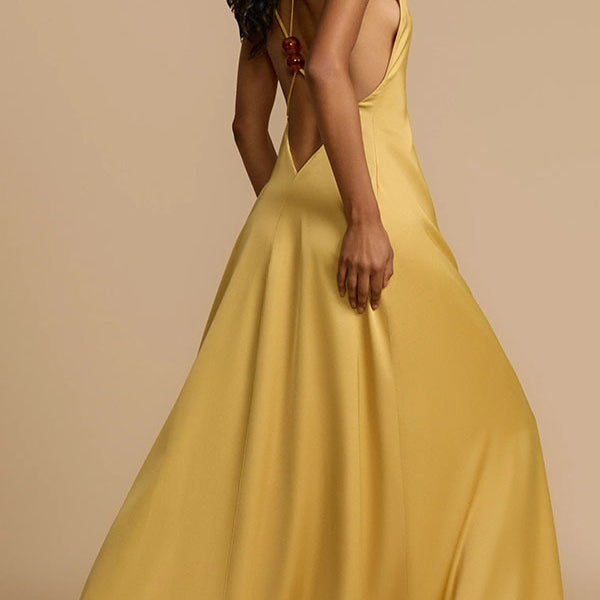 Elegant yellow satin maxi dress showcasing luxurious fashion and langry style