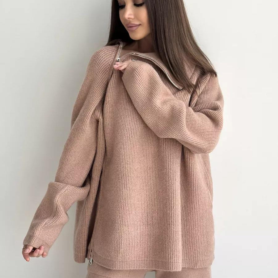 Woman in a beige knit sweater and pants from Langry’s fashion collection ملابس