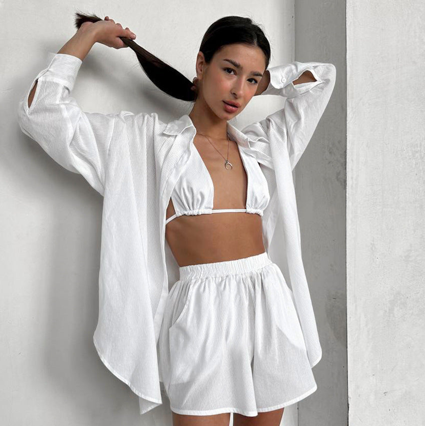 Woman wearing comfort cotton loose pajamas with white shirt, bikini top, and shorts
