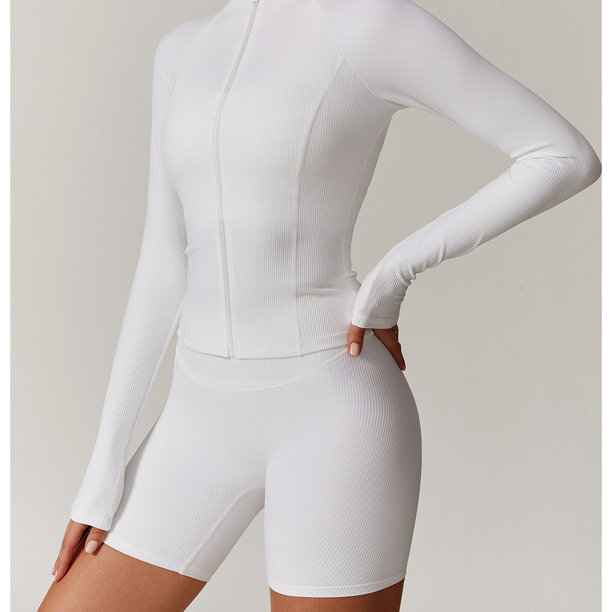 White long-sleeved athletic romper with fitted shorts for casual running fashion ملابس