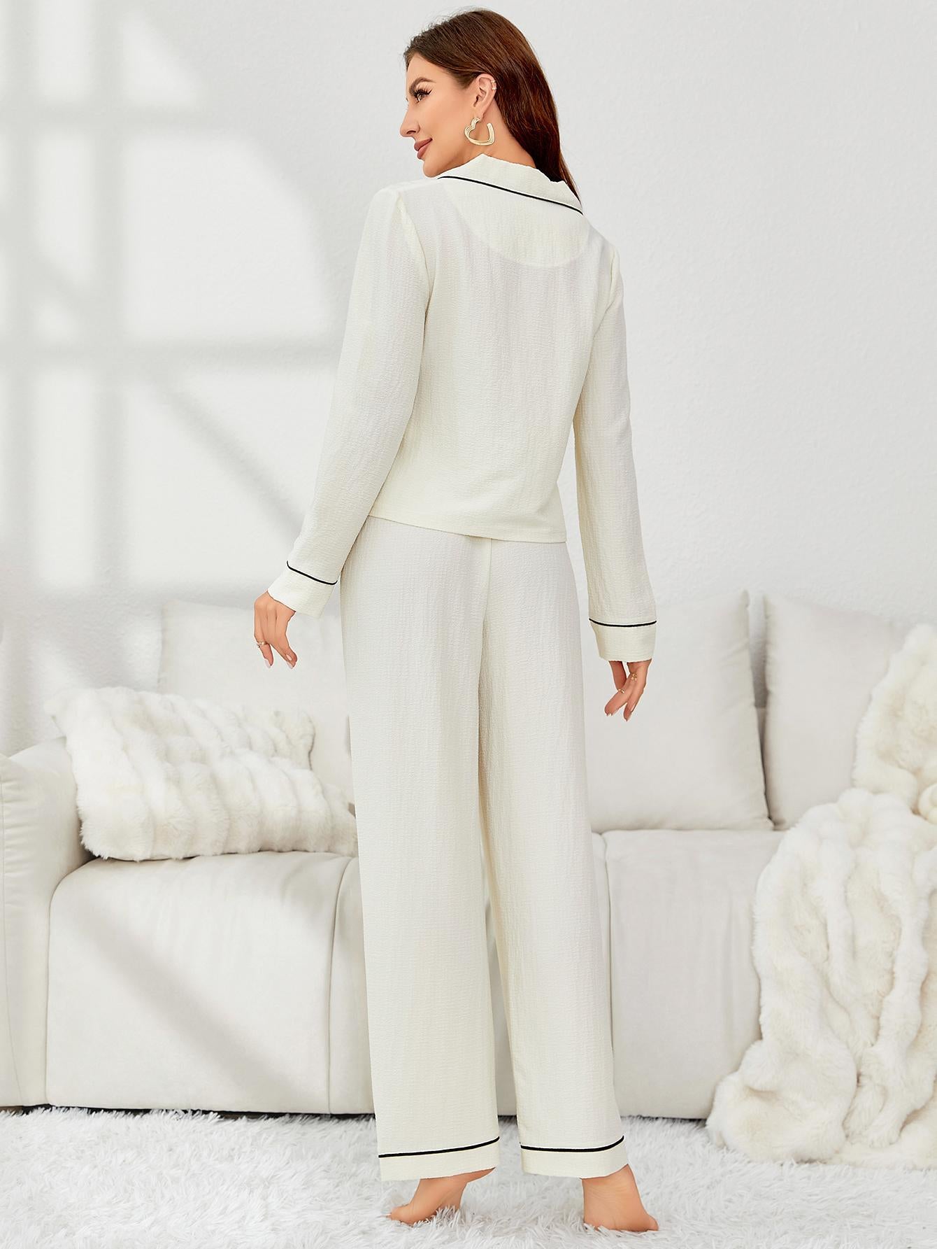 Off-white pajama set with black piping details from Home Wear Autumn Winter collection, stylish ملابس for women
